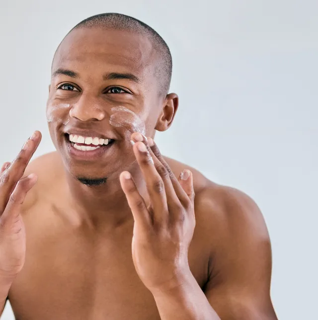 Man’s skin assessed before a summer treatment at Anima Med Spa