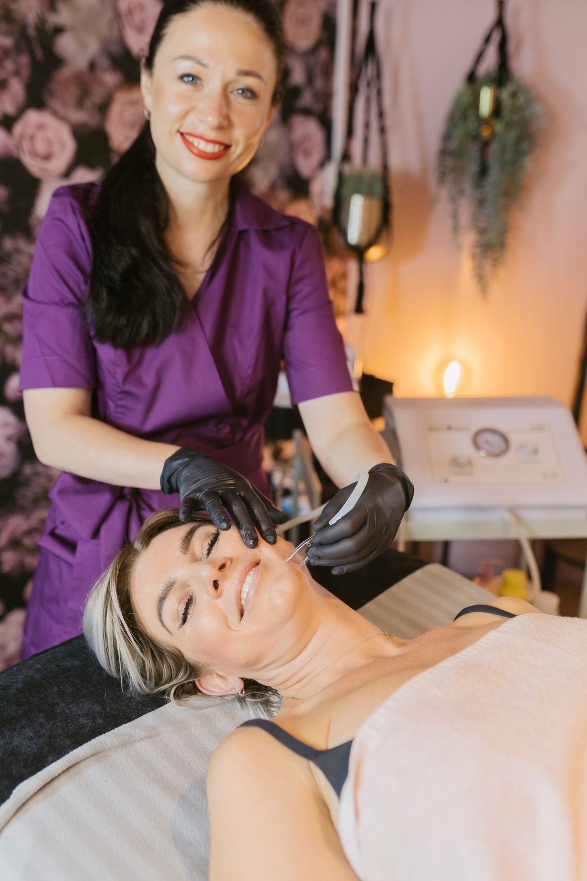An aesthetician performing a skin treatment